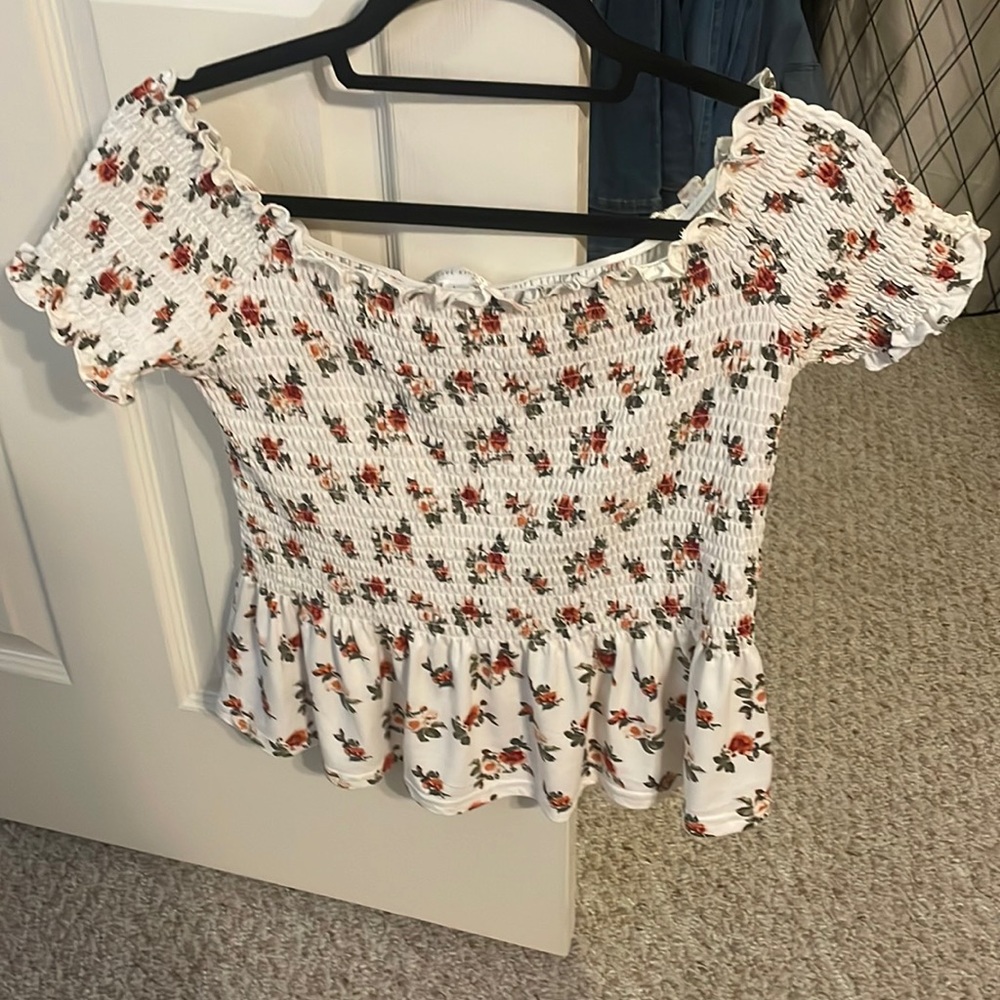 White ruffled baby doll style shirt size M/L